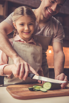 Father and daughter cooking
