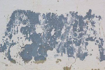 chipped paint on an old plaster wall