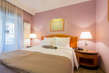 Fototapeta na wymiar Interior of a new hotel double bed bedroom