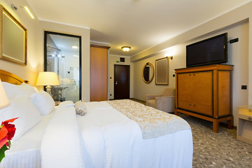 Interior of a new modern hotel double bed bedroom