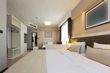 Fototapeta na wymiar Interior of a new hotel bedroom
