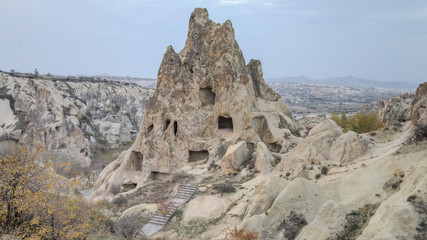 Fototapeta na wymiar Cappadocia, Turkey - November 15, 2014: Panorama of unique geological formations in Cappadocia, Turkey. 