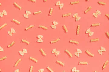 Farfalle and fusilli pasta flat lay pattern