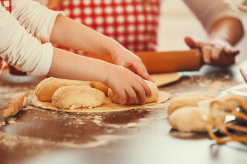 Mother and Daughter Working With Dough Together, Making Croissan