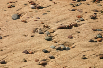 Beautiful beach with a colorful pebbles in sand