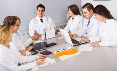 Fototapeta premium Health-care workers and head physician at colloquium in clinic