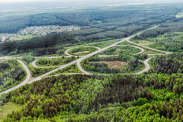 Aerial view of highway interchange. Road junction. Aerial view. Photo with noise from action camera