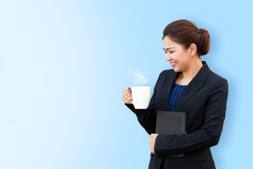Business woman is holding white mug with copy space