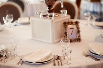 Card with number 7 put in a steel frame with roses stands on rou