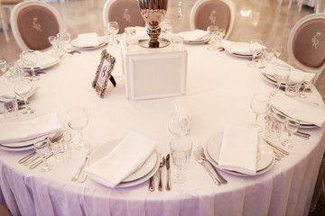 Frame with table number 8 stands beneath white box