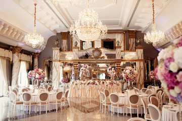 Luxurious dinner hall arranged for rich wedding party