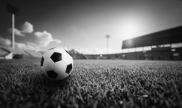 Soccer ball on the grass in soccer stadium , Black and white