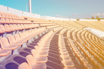 Fototapeta premium Empty seats at soccer stadium , vintage