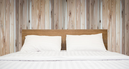 white bedding and pillow in hotel room