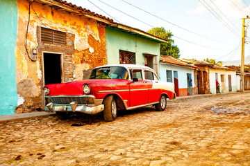 Red Classic Car in the colonial town of Trinidad, Cuba