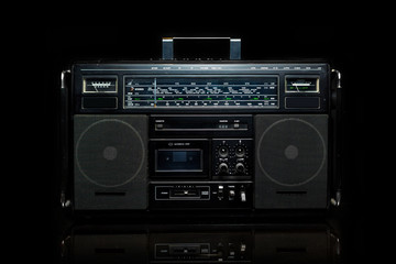Vintage boom box on black background
