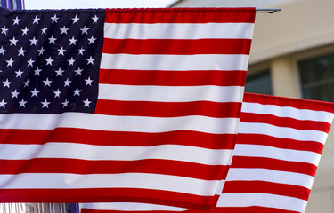 Fototapeta premium American flag in front of a city