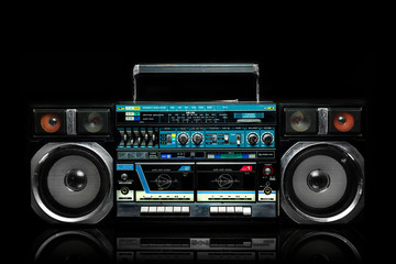 Vintage boom box on black background © nehopelon