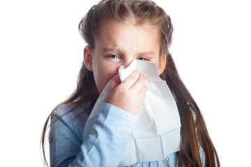 Little girl is blowing her nose