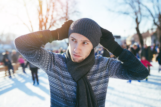 Man portrait at ice-skating rink. 