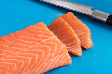 Slicing salmon fillet