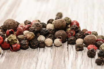 Set of whole peppercorns, handful of red, black, white peppercorns. Herbs and spices concept