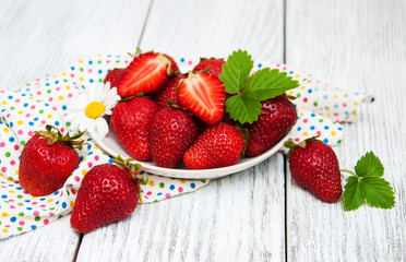 ripe strawberries on wooden table