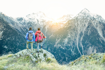 Fototapeta premium Two hiker friends at peak of the alps mountains in france