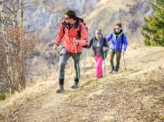 Naklejka na ściany i meble Tour scout guide bringing young couple for trekking excursion
