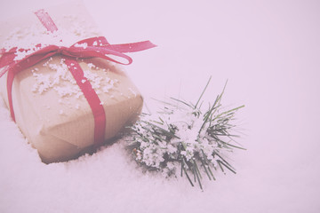Christmas presents in brown paper with red ribbon Vintage Retro