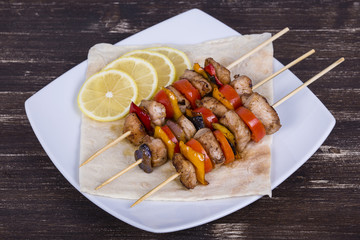 Tasty grilled meat and vegetables on skewer