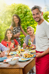 Group of friends enjoying lunch on a terrace