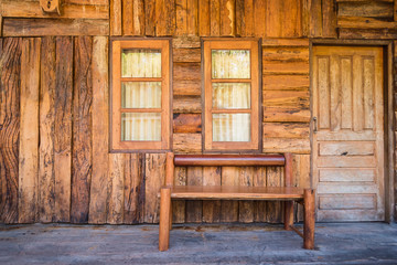 Obraz na płótnie Canvas Front view of vintage wood room with chair, window and door