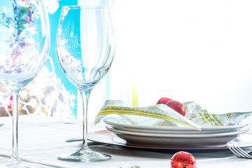Christmas table place setting with christmas decorations