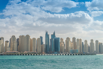 Fototapeta na wymiar DUBAI - DECEMBER 2016: Marina buildings on a sunny day. Dubai at