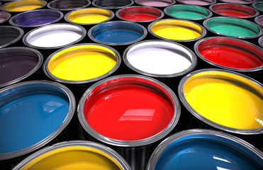 Fototapeta premium Rows of steel paint cans with vibrantly coloured liquid paint
