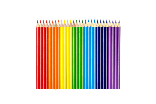 Rainbow from a set of color pencils over a white background