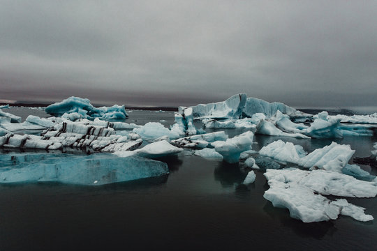 Icebergs on dark day 