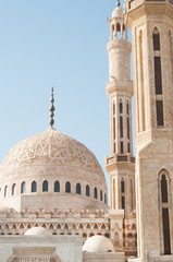 View of the tower of the ancient mosque. Mosque entrance ornament. Islamic ornaments on wall. Arab symbols. Al Mustafa Mosque Sharm El Sheikh. Ancient wall