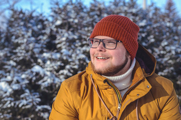 Portrait of a smiling young man in warm clothing