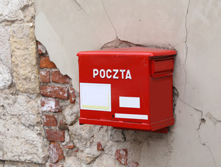 red mailbox with the words POLISH POSTAL service