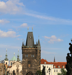 Fototapeta premium High tower with battlements of the Charles Bridge in Prague Old