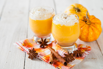 ice honey pumpkin spice smoothie with whipped cream. selective focus. copy space