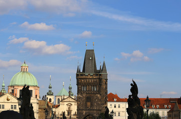 skyline of prague with the medieval tower of the Charles Bridge