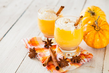 ice honey pumpkin spice smoothie with whipped cream. selective focus. copy space