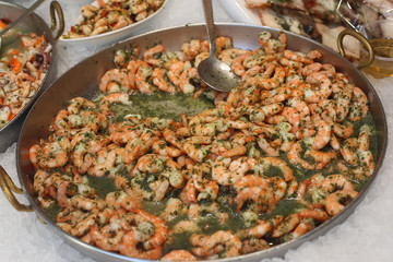 pink shrimp pan cooked with parsley and broth