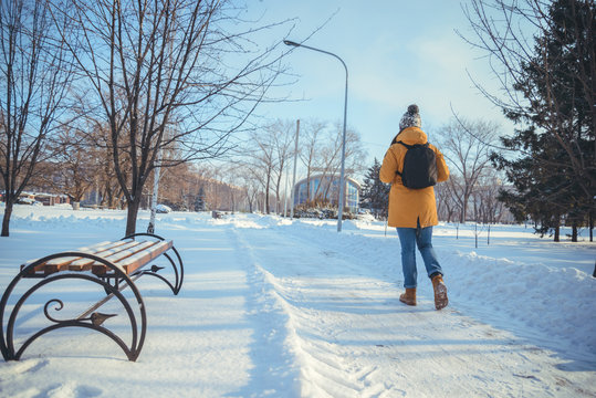 Woman Walking In Winter Park