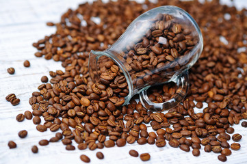 Glass milk jug and coffee beans