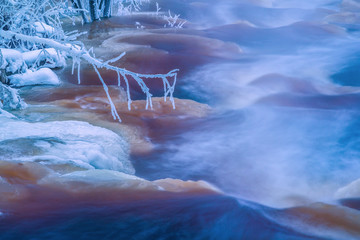 Freezing cold winter stream landscape
