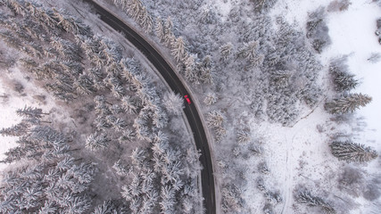 Red car in the snowy mountains